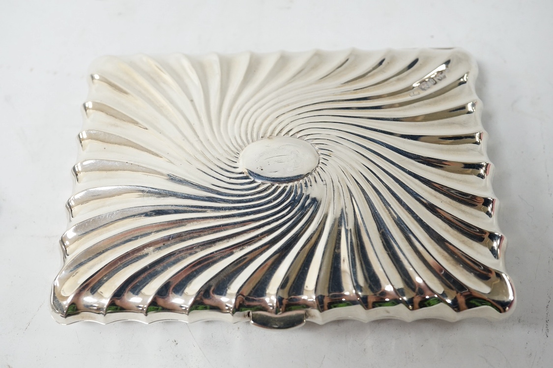 A late Victorian engraved silver card purse, by William Summers, London, 1880, 10cm, together with a similar wrythened silver card purse, Birmingham, 1892 and a small late Victorian silver card case. Condition - fair to